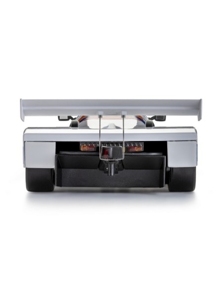 trasera del modelo de slot Porsche 962C Joest Racing en pista de competición.