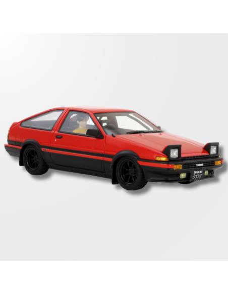 Vista frontal del Toyota Trueno rojo con faros abiertos y llantas negras de slot.